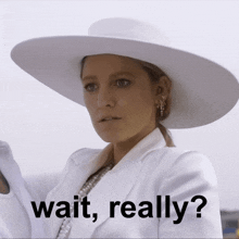 a woman wearing a white hat with the words wait really on the bottom