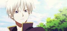 a boy with white hair and blue eyes looks to the side