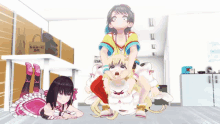 three anime girls are laying on the floor in front of a cardboard box that says " 666 "