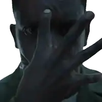 a man covering his face with his hand with his finger