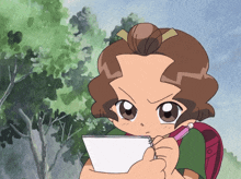 a girl with brown hair is holding a piece of paper