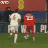 a soccer player with the number 2 on the back of his shirt