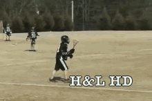 a lacrosse game is being played on a field with the words h & l hd on the bottom