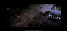 a car is driving down a street at night