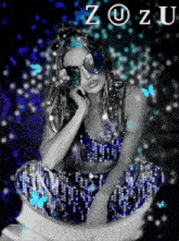 a woman wearing sunglasses is sitting on a toilet with the word zozu written above her
