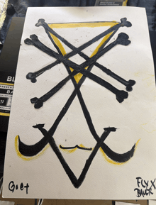a piece of paper with a drawing of a cross and the name goet on it