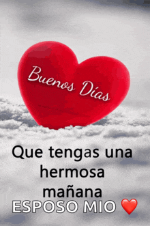 a red heart with the words buenos dias que tengas una hermosa manana esposo mio