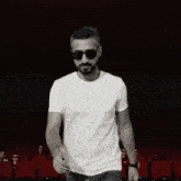 a man wearing sunglasses and a t-shirt that says talent