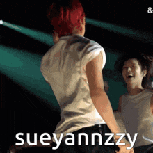 a man with red hair is dancing with the name sueyannzzy written on the bottom