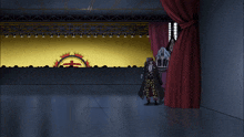 a group of people are standing in front of a stage