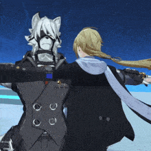 a man and a woman are standing next to each other with their arms outstretched