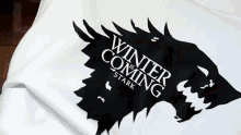 a white shirt with the words winter is coming on it