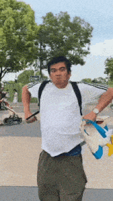 a man wearing a white shirt with donald duck on it is making a funny face