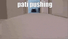 a cat is crawling out of a litter box with the words pati pushing written above it .