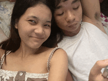 a man and a woman are laying next to each other