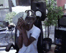 a man in a white shirt is holding money in his hands