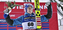 a man in a blue jacket with the number 60 on the front