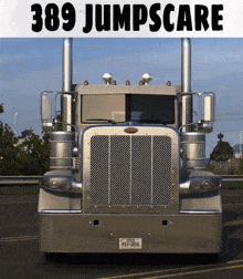 a silver peterbilt semi truck with a texas license plate