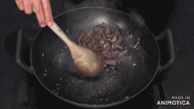a man is cooking in a kitchen with the words made in animatica on the bottom right