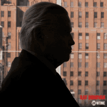 a poster for ray donovan showtime shows a man in a suit and tie
