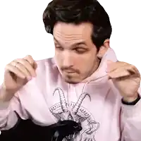 a man wearing a hoodie with a goat on it