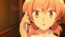 a close up of a girl talking on a phone