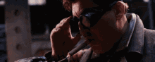 a man smoking a cigar with a lighter in his hand