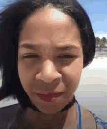 a close up of a woman making a funny face