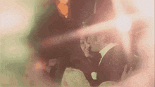 a man in a tuxedo and a woman in a dress are kissing