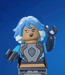 a lego figure with blue hair and a shield on his chest