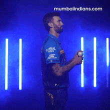 a man in a blue shirt with the word astro on it