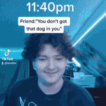 a man with curly hair is smiling in front of a screen that says 11:40pm