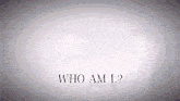 a gray background with the words who am i