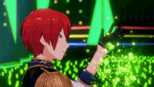 a boy with red hair is standing in front of a crowd with green lights