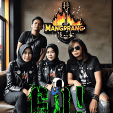 a group of people posing in front of a sign that says mangprang
