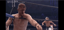 a man in a wrestling ring with the number 17 on the bottom right