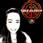 a girl is smiling in front of a peace sign that says keep alive