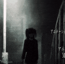 a girl with pigtails is standing in a dark alleyway next to a train .