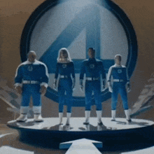 a group of fantastic four figures standing in front of a fantastic four logo