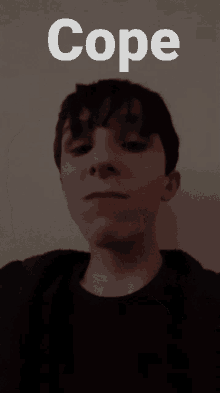 a young boy eating a cookie with the word cope behind him