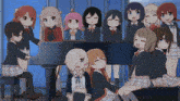 a group of anime girls are posing for a picture