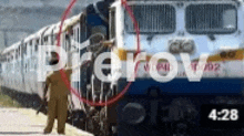 a man is standing in front of a train with the word prerov written on it .