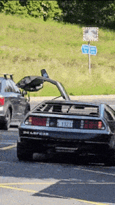 a car with a license plate that says d-1323 is parked in a parking lot