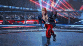a man in a blue jacket and red pants is standing in a ring with a sign that says dom