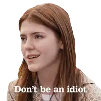a woman with red hair is smiling with the words " don 't be an idiot " below her