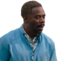 a man with a blue jacket and a scarf around his neck looks at the camera