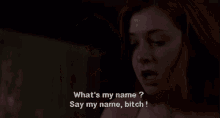 a woman is sitting on a couch with her eyes closed and saying what 's my name ? say my name bitch !