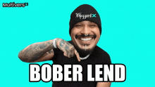 a man wearing a beanie with the word blizzard on it smiles
