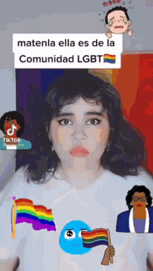 a woman is holding a rainbow flag in front of her face while wearing a white shirt .