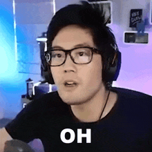 a man wearing glasses and headphones with the word oh on his face